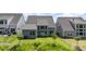 Wide angle backyard view with blue siding and a well-manicured lawn at 18019 Wilbanks Dr, Charlotte, NC 28278