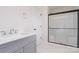 Elegant bathroom featuring a gray vanity and a glass-enclosed shower with modern fixtures at 18019 Wilbanks Dr, Charlotte, NC 28278