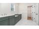 Elegant bathroom featuring double vanities, modern fixtures, and stylish marble flooring at 18019 Wilbanks Dr, Charlotte, NC 28278