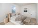 A cozy bedroom features neutral tones, stylish furniture, a window and modern decor at 18019 Wilbanks Dr, Charlotte, NC 28278