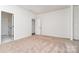 Bedroom features neutral carpet, and convenient access to other rooms through multiple doorways at 18019 Wilbanks Dr, Charlotte, NC 28278