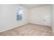 Comfortable bedroom with soft carpet, a white painted door, and lots of natural light at 18019 Wilbanks Dr, Charlotte, NC 28278