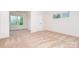 Neutral carpeted bedroom with one window and a connecting door, perfect for comfortable living at 18019 Wilbanks Dr, Charlotte, NC 28278