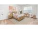 A serene bedroom with a cozy decor, a desk, a flamingo and a spacious area at 18019 Wilbanks Dr, Charlotte, NC 28278