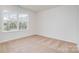 Light filled bedroom with a large window offering views of the neighborhood at 18019 Wilbanks Dr, Charlotte, NC 28278