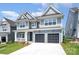 Beautiful two-story home with a covered porch and a two-car garage, showcasing modern architecture at 18019 Wilbanks Dr, Charlotte, NC 28278