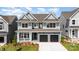 Attractive two-story home features a welcoming porch, two-car garage, and a manicured front yard at 18019 Wilbanks Dr, Charlotte, NC 28278