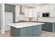 Modern kitchen featuring a large center island, stainless steel appliances, and two-toned cabinetry at 18019 Wilbanks Dr, Charlotte, NC 28278