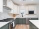 Stylish kitchen with stainless appliances, two-tone cabinets, and ample counter space for cooking at 18019 Wilbanks Dr, Charlotte, NC 28278