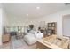 Bright living room features an open concept, a foosball table, and a wooden bookshelf at 18019 Wilbanks Dr, Charlotte, NC 28278