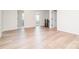 Living room with light wood floors and convenient access to other rooms through doorways at 18019 Wilbanks Dr, Charlotte, NC 28278