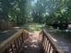 Large backyard with lush green foliage. Perfect for relaxation, entertainment, and outdoor activities at 2017 Ashley Rd, Charlotte, NC 28208