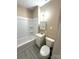 Cozy bathroom with shower-tub combination and storage sink at 2017 Ashley Rd, Charlotte, NC 28208
