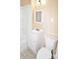 Bathroom with a white vanity, mirror, and toilet at 2017 Ashley Rd, Charlotte, NC 28208