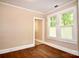 Bright bedroom with hardwood floors and natural light from the windows at 2017 Ashley Rd, Charlotte, NC 28208