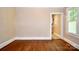 Spacious living room with hardwood floors and neutral paint at 2017 Ashley Rd, Charlotte, NC 28208