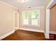 Bright living room with hardwood floors and natural light from large windows at 2017 Ashley Rd, Charlotte, NC 28208