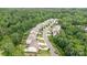 Lovely aerial view of a neighborhood showing a tree lined street with well maintained lawns at 2037 Christopher Wood Ct, Fort Mill, SC 29707