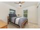 Bedroom showcasing a comfortable bed, natural light from a window, and ceiling fan at 2037 Christopher Wood Ct, Fort Mill, SC 29707