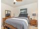 Tranquil bedroom offers a cozy bed, wood furniture, and soft lighting fixtures at 2037 Christopher Wood Ct, Fort Mill, SC 29707