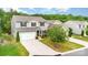 Two-story home with neutral siding, black shutters, a two-car garage, landscaping, and a mature tree at 2037 Christopher Wood Ct, Fort Mill, SC 29707