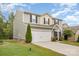 Two-story home with neutral siding, black shutters, a two-car garage, and well-maintained landscaping at 2037 Christopher Wood Ct, Fort Mill, SC 29707