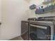 Modern laundry room with front load washer and dryer and shelving at 2037 Christopher Wood Ct, Fort Mill, SC 29707