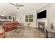 Inviting living room features a fireplace, ceiling fan, and wood-look floors at 2037 Christopher Wood Ct, Fort Mill, SC 29707