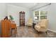 Bright living room featuring wood floors, seating area, piano and plenty of natural light at 2037 Christopher Wood Ct, Fort Mill, SC 29707