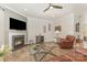 Cozy living room with fireplace, decorative art, and wood-look floors at 2037 Christopher Wood Ct, Fort Mill, SC 29707