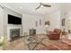 Cozy living room with fireplace, decorative art, and wood-look floors at 2037 Christopher Wood Ct, Fort Mill, SC 29707