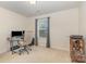 A bright home office features a desk, comfortable chair, natural light, and storage at 2037 Christopher Wood Ct, Fort Mill, SC 29707