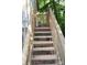 Wooden back stairs lead from house to backyard with views of nature at 226 Lake Sylvia Rd, Lincolnton, NC 28092