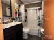 Bathroom featuring a shower, dark brown vanity, and updated fixtures at 226 Lake Sylvia Rd, Lincolnton, NC 28092