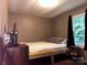 Simple bedroom with a full size bed and view to outside at 226 Lake Sylvia Rd, Lincolnton, NC 28092