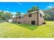 Brick home exterior with well-maintained lawn and shrubbery showcasing the backyard and foundation at 2323 Brookwood Rd, Lincolnton, NC 28092