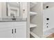 Stylish bathroom with floating shelves, a granite countertop, black hardware, and bathtub at 2323 Brookwood Rd, Lincolnton, NC 28092