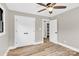 Bright bedroom features wood-look floors, neutral walls, ceiling fan and large closet at 2323 Brookwood Rd, Lincolnton, NC 28092