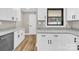 Bright kitchen features white cabinets with dark hardware and granite countertops, stainless steel appliances at 2323 Brookwood Rd, Lincolnton, NC 28092