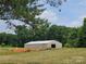Exterior view of the spacious barn with metal roof, on a level lot at 2905 Medlin Rd # 40 Acres, Monroe, NC 28112