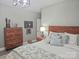 Bedroom with wooden dresser and headboard, side table, and stylish lamps, providing a comfortable space at 2905 Medlin Rd # 40 Acres, Monroe, NC 28112