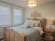 Cozy bedroom with decorative pillows, a wooden bed frame, and a light fixture at 2905 Medlin Rd # 40 Acres, Monroe, NC 28112