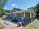 Exterior view of the home showing a covered porch with columns and chess set at 2905 Medlin Rd # 40 Acres, Monroe, NC 28112