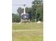 A white helicopter is landing on a well-manicured grassed area at 2905 Medlin Rd # 40 Acres, Monroe, NC 28112