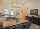 Bright kitchen with a dining area featuring a wooden table, chairs, and modern lighting at 2905 Medlin Rd # 40 Acres, Monroe, NC 28112