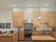 Bright kitchen features modern appliances, light wood cabinetry, and granite countertops at 2905 Medlin Rd # 40 Acres, Monroe, NC 28112