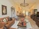 Open-concept living room with leather seating, decorative lighting, and dining area at 2905 Medlin Rd # 40 Acres, Monroe, NC 28112
