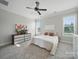 A relaxing bedroom with neutral tones, abundant natural light, and plush carpeting at 3007 Arsdale Rd, Waxhaw, NC 28173