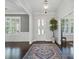 Bright foyer features a modern light fixture, hardwood floors, and an inviting atmosphere at 3007 Arsdale Rd, Waxhaw, NC 28173