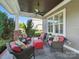 Inviting covered porch features cozy seating with a ceiling fan and tiled flooring at 3007 Arsdale Rd, Waxhaw, NC 28173